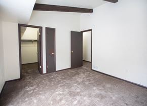 Mckeesport apartment for rent - A room with carpeted floor and three doors.