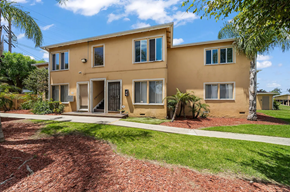 Harbor City apartment for rent - A two-story house with a red brick walkway in front.