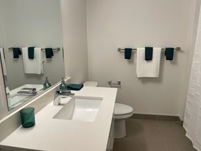 Halifax apartment for rent - A bathroom with a white counter top and a white toilet.