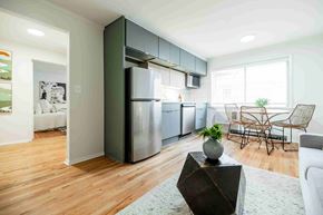 Atlanta apartment for rent - A modern kitchen with a wooden floor and a large island.