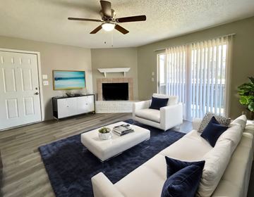 Baton Rouge apartment for rent - a living room with a white couch and a coffee table