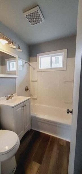 Gary house for rent - a bathroom with a white toilet and a tub and a sink