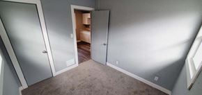 Gary house for rent - a hallway with a door to a bedroom and a closet