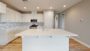 Chico apartment for rent - A kitchen with a white island in the middle.