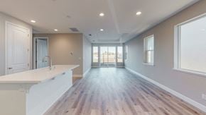 Chico apartment for rent - A spacious kitchen with wooden floors and white countertops.