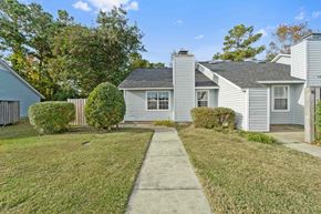 Havelock house for rent - A house with a grey roof and a white fence.