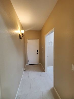 Chandler house for rent - the entryway of a home with a marble floor and a white door