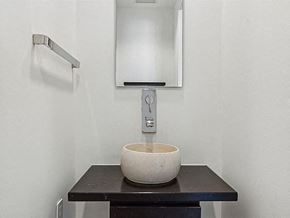 San Antonio apartment for rent - a bathroom with a bowl sink and a mirror