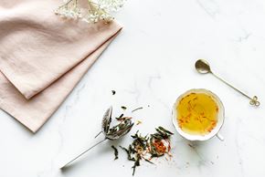Buena Park apartment for rent - a table with a bowl of tea and some flowers