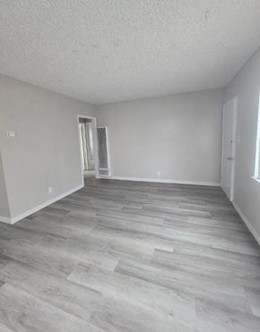 Ontario apartment for rent - A room with a grey floor and white walls.