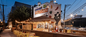 Philadelphia apartment for rent - the exterior of a restaurant at night with lights on the building