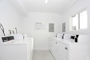 Azusa apartment for rent - A white laundry room with washers and dryers.