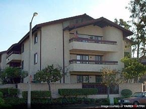 Costa Mesa apartment for rent - a building with a flag on the side of it