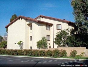 Costa Mesa apartment for rent - a large white house with a street in front of it