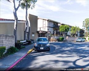 Port Hueneme apartment for rent - A black car is parked in front of a building with the number 703 on it.
