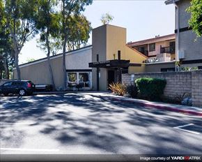 Port Hueneme apartment for rent - A car is parked in front of a building with a sign that reads "CALIFORNIA".