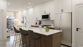 Edmonton house for rent - a kitchen with a large island with three stools