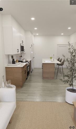 Edmonton house for rent - an open kitchen and dining area with a table and chairs
