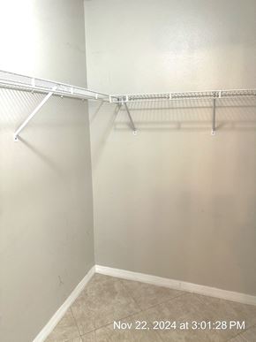 Orlando house for rent - Empty white closet with a shelf and a timestamp in the corner.