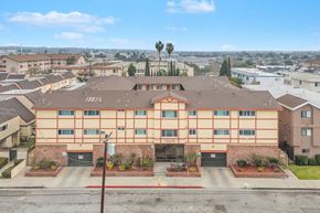 Hawthorne apartment for rent - A large apartment complex with a red roof and a sign that reads 15828.