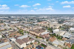Hawthorne apartment for rent - A bird's eye view of a residential area with houses and buildings.