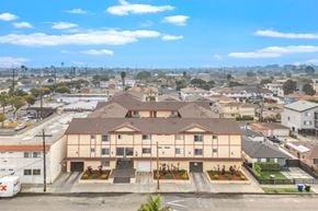 Hawthorne apartment for rent - A large apartment complex with a parking lot in front.