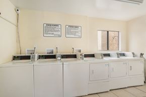 Hawthorne apartment for rent - A row of washing machines are in a laundromat.