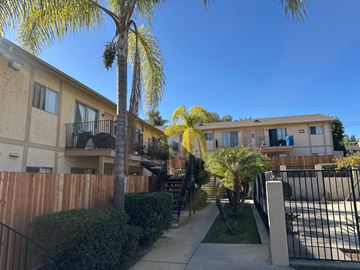 Vista apartment for rent - A sunny day in a residential area with a clear blue sky.