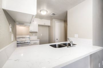 San Marcos apartment for rent - A kitchen with a white counter top and a sink.