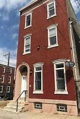 Philadelphia apartment for rent - a red brick building with white windows and stairs