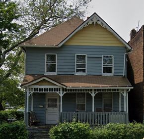 Cleveland apartment for rent - A small house with a porch and a front door.