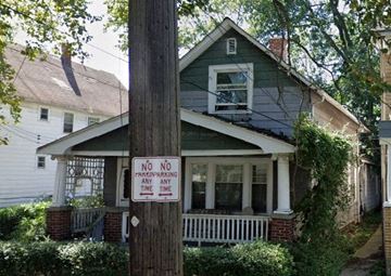 Cleveland apartment for rent - A sign on a pole in front of a house states "NO PARKING ANY TIME".