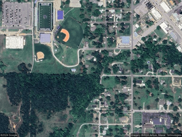 Harrah house for rent - A satellite image shows a football field, a baseball diamond, and a soccer field in a campus setting.
