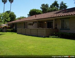 Thousand Oaks apartment for rent - A house with a brown roof and a green lawn in front.