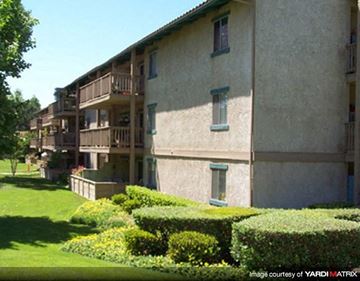 Thousand Oaks apartment for rent - A building with a green lawn in front of it.