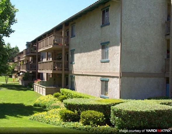 Thousand Oaks apartment for rent - A building with a green lawn in front of it.