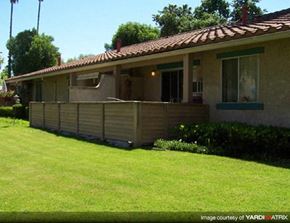 Thousand Oaks apartment for rent - A house with a red tile roof and a wooden fence.