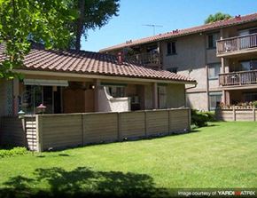 Thousand Oaks apartment for rent - A house with a brown tiled roof and a wooden fence.