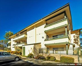 Hayward apartment for rent - A modern two-story building with a car parked in front.