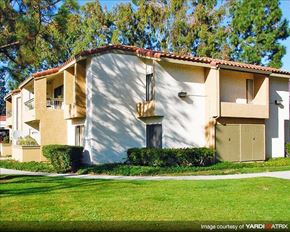 Laguna Niguel apartment for rent - A two-story house with a red tile roof and a balcony on the second floor.