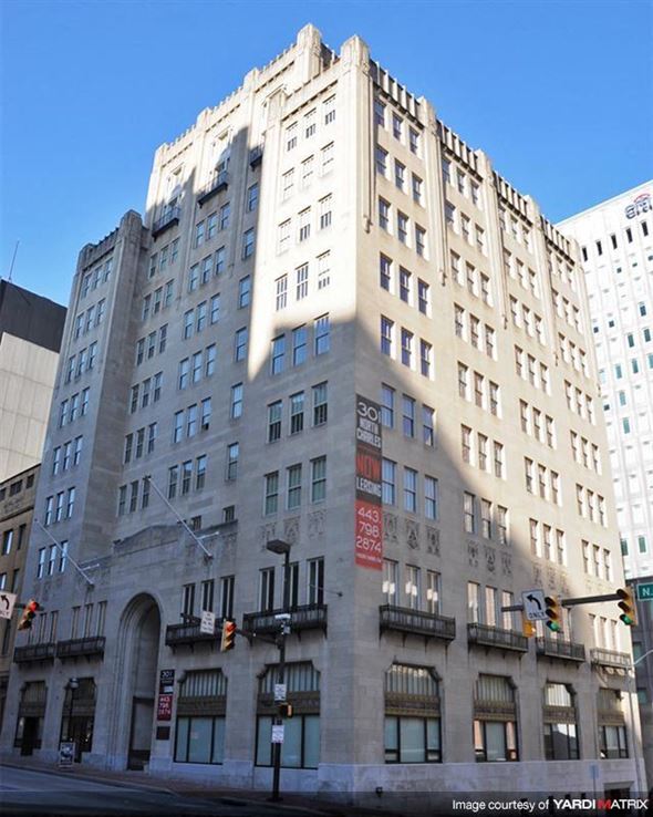 Baltimore apartment for rent - a large building on the corner of a city street