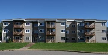 Kentville apartment for rent - Apartment building with a green lawn in front.