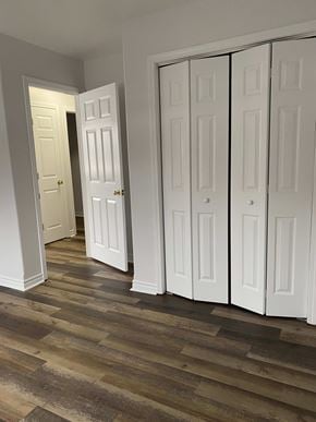 Kentville apartment for rent - A room with white doors and wooden flooring.
