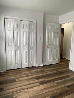 Kentville apartment for rent - A room with white doors and a wooden floor.
