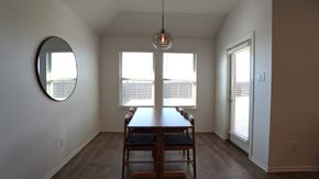 Royse City house for rent - A dining room with a table and chairs.