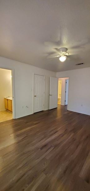 Purvis apartment for rent - A room with wooden floors and white walls.