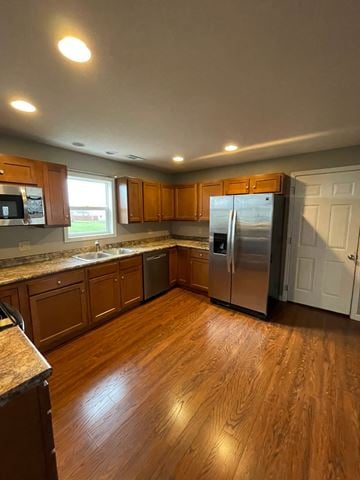 Elida house for rent - A kitchen with wooden cabinets and a refrigerator.