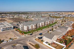Red Deer apartment for rent - A large apartment complex is under construction in a suburban area.