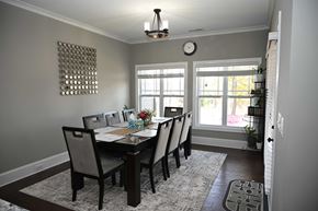 Garner house for rent - A dining room with a table set for six.