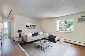 Denver apartment for rent - a living room with a couch and a table